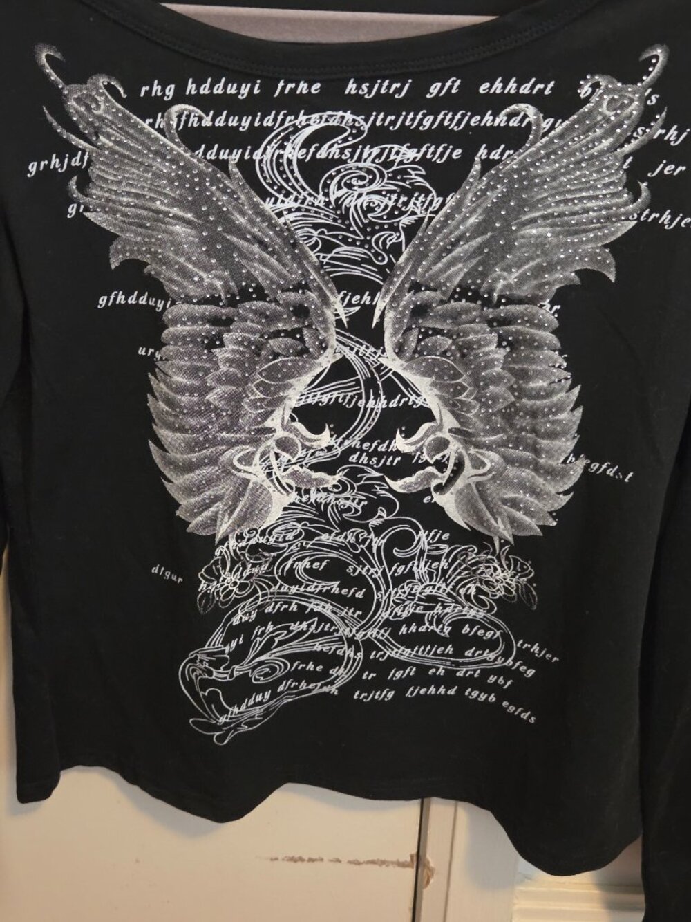 Black long sleeve graphic top
